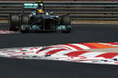 Lewis Hamilton attacks the chicane on soft tyres