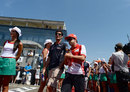 Mark Webber and Fernando Alonso head on the drivers' parade