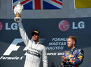 Lewis Hamilton celebrates alongside Sebastian Vettel on the podium
