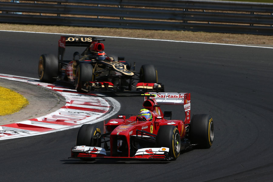 Kimi Raikkonen chases down Felipe Massa