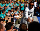 Lewis Hamilton celebrates with his Mercedes team