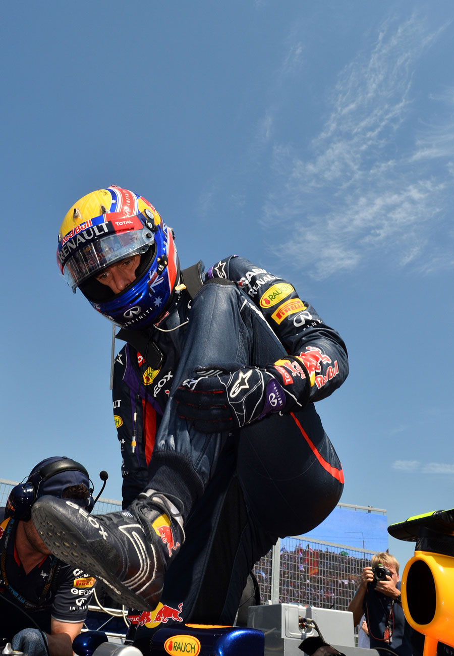Mark Webber steps out of his car on the grid