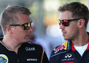 Kimi Raikkonen and Sebastian Vettel chat in the paddock