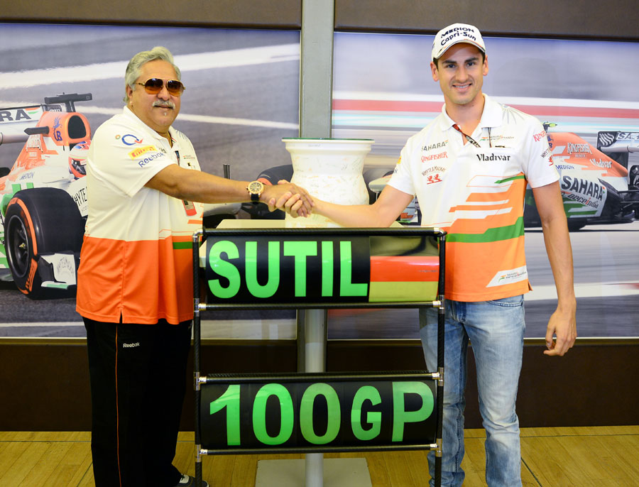 Adrian Sutil celebrates his 100th grand prix with Force India
