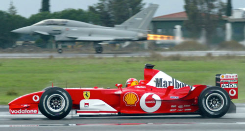 Michael Schumacher takes on a Eurofighter Typhoon in his Ferrari F2003