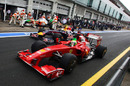 Massa and Vettel jockey for position in the pit lane