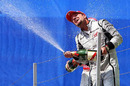 Barrichello on the podium after his win at Valencia