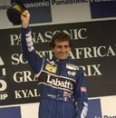 Alain Prost of France celebrates victory in the South African Grand Prix