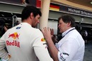 Mark Webber chats to Mercedes boss Norbert Haug