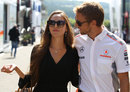 Jenson Button and his girlfriend Jessica Michibata enjoy the sunshine in the paddock on Thursday