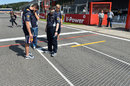 Red Bull inspects drainage channels cut in to the grid