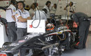 Sauber works on Nico Hulkenberg's car in the garage