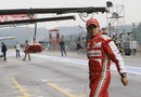 Felipe Massa walks back in to the Ferrari garage