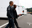 Lewis Hamilton and his father Anthony arrive in the paddock