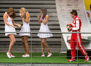 Fernando Alonso sprays some grid girls on the podium