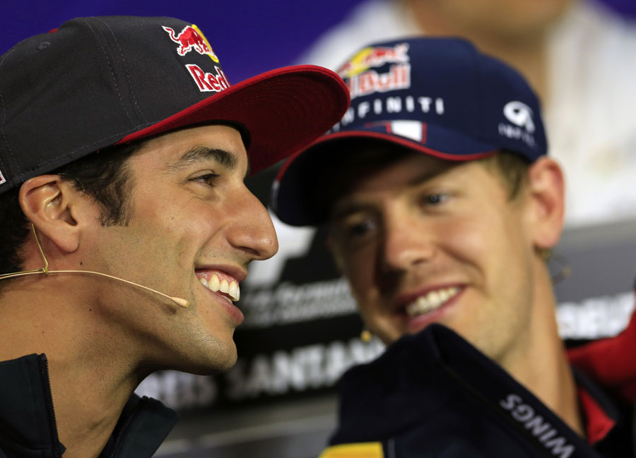 Daniel Ricciardo shares a joke with Sebastian Vettel in the press conference