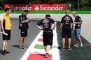 Sebastian Vettel and Red Bull inspect one of the exit kerbs
