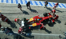 Fernando Alonso's Ferrari is wheeled out ahead of Friday practice