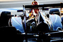 Mark Webber waits in the Red Bull garage
