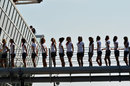 Grid girls line up by the podium