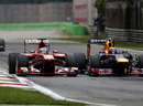 Fernando Alonso makes a move around the outside of Mark Webber at the second chicane
