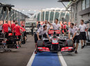 McLaren mechanics return their car from scrutineering