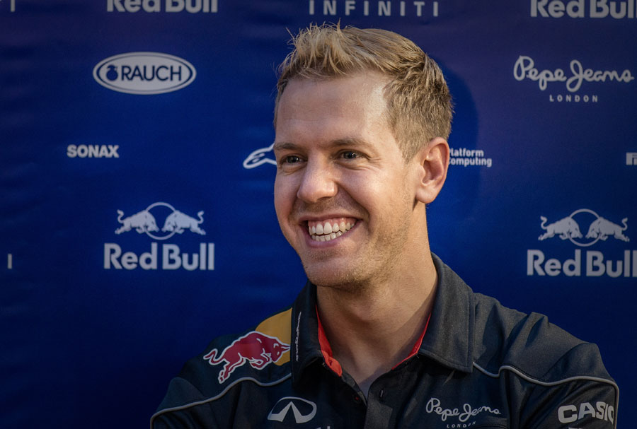 Sebastian Vettel smiles for the cameras