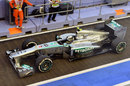 Lewis Hamilton leaves the pits in his Mercedes
