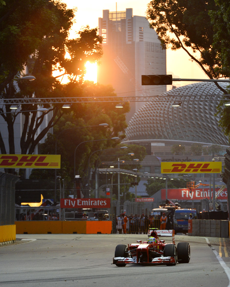 The sun sets while Felipe Massa is on track