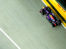 Sebastian Vettel uses the full width of the track