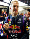 Sebastian Vettel celebrates pole position in the Red Bull garage after opting not to go for a final run in Q3