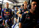 Sebastian Vettel watches on in the Red Bull garage after opting not to go for a final run in Q3