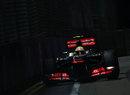 Sergio Perez drives through the shadows
