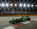 Charles Pic guides his car under the spotlights