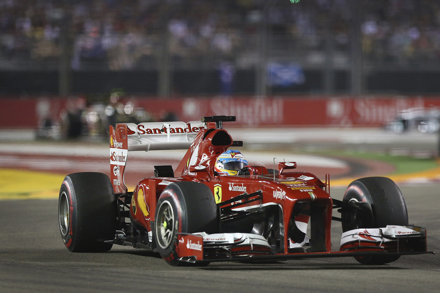 Fernando Alonso steers his Ferrari into the corner