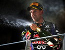 Sebastian Vettel celebrates victory on the podium