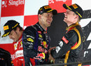 Sebastian Vettel sprays Kimi Raikkonen with champagne on the podium