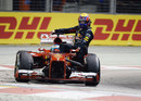 Mark Webber catches a lift back to the paddock with Fernando Alonso at the end of the race