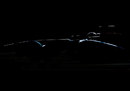The silhouette of Romain Grosjean's car under the lights 