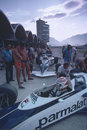 Nelson Piquet and Riccardo Patrese wait in the pit lane during practice