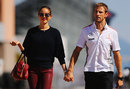 Jenson Button arrives in the paddock with his girlfriend Jessica Michibata