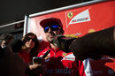 Fernando Alonso faces the media outside the Ferrari hospitality unit