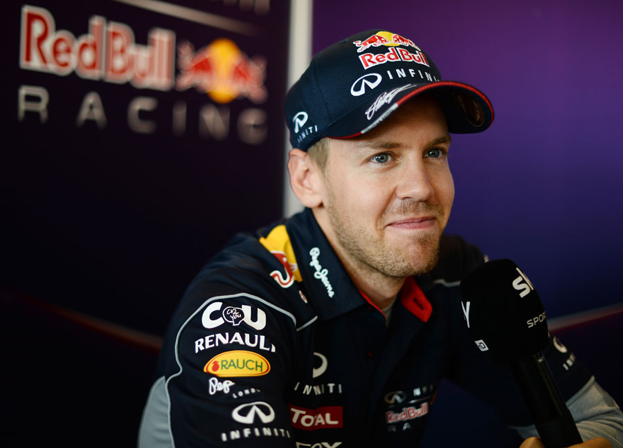 Sebastian Vettel talks to the press
