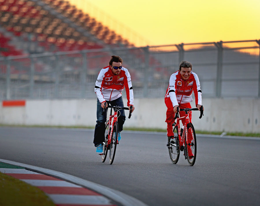 Fernando Alonso cycles the circuit on Thursday evening
