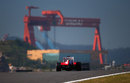 Fernando Alonso crests a hill early in FP1