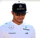 Lewis Hamilton arrives in the paddock