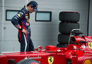 Mark Webber inspects a Ferrari in parc ferme