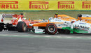 Paul di Resta and Adrian Sutil try to avoid a spinning Felipe Massa