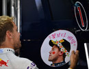 Sebastian Vettel admires a gift from a fan
