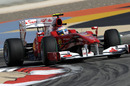 Fernando Alonso lifts a wheel in the Ferrari